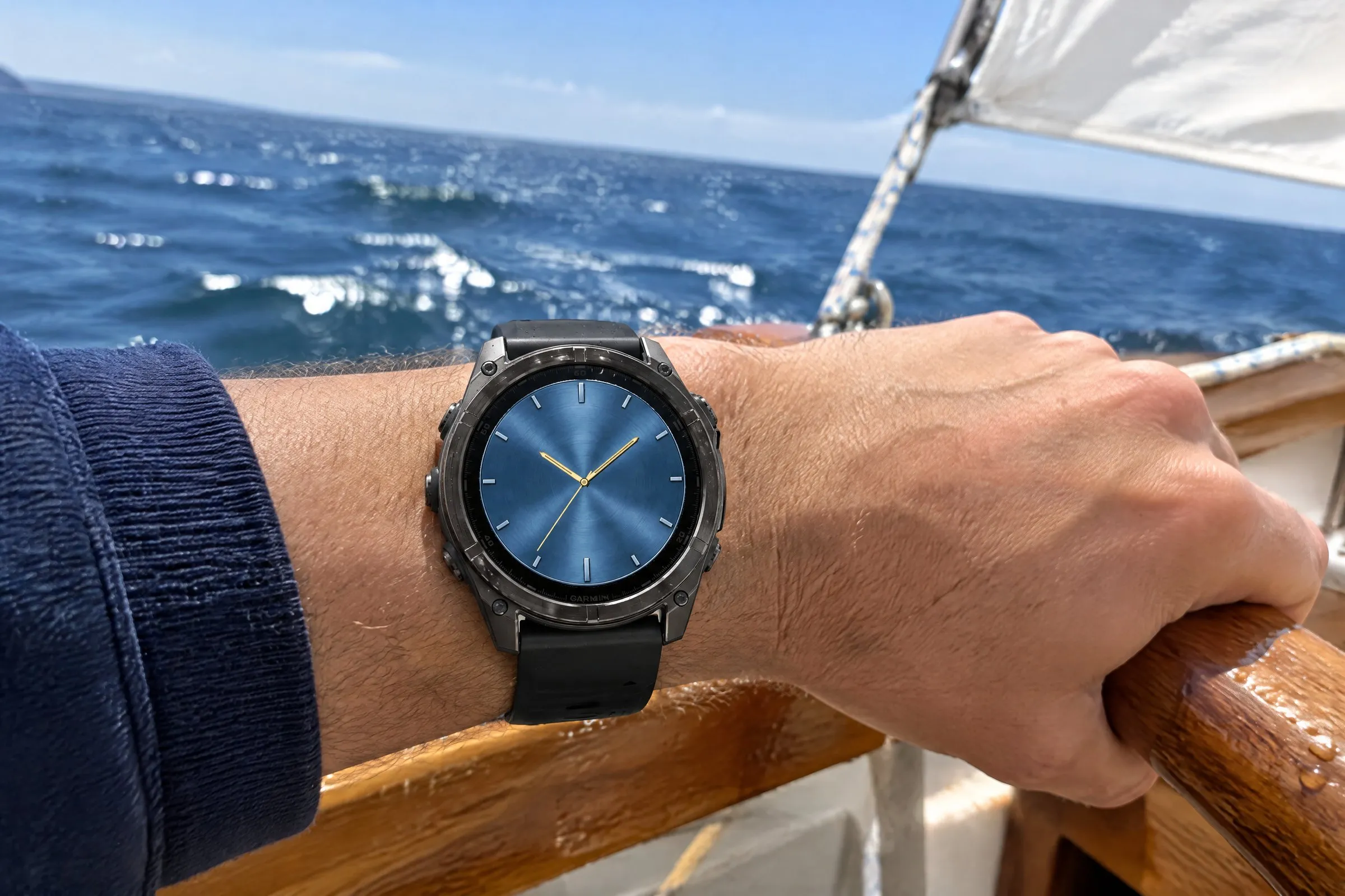 Classic Garmin watch face Classic Five in blue on a fēnix 8 on the wrist while sailing