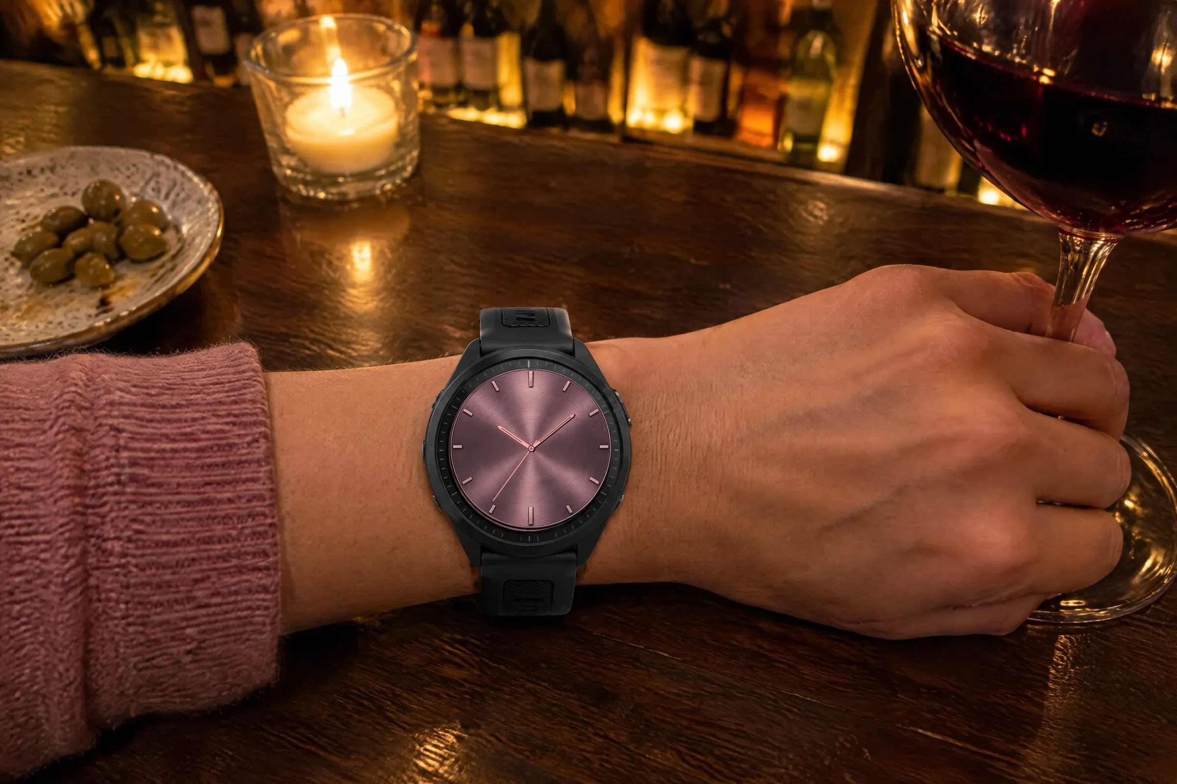 Classic Garmin watch face Classic Five in pink on a Forerunner 570 in a wine bar