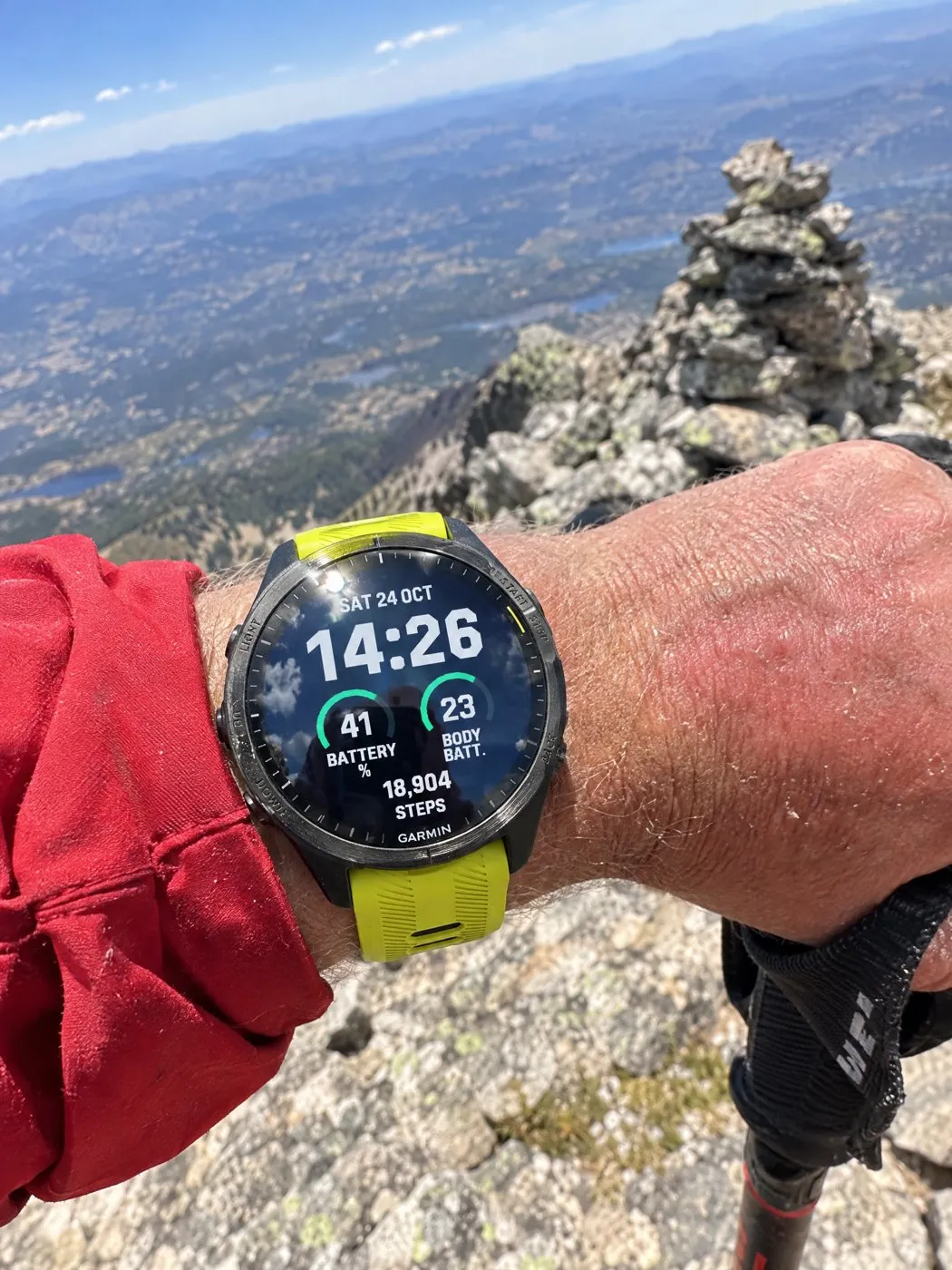 Big digital Garmin watch face Fieldline on a Forerunner 965 on a mountain summit