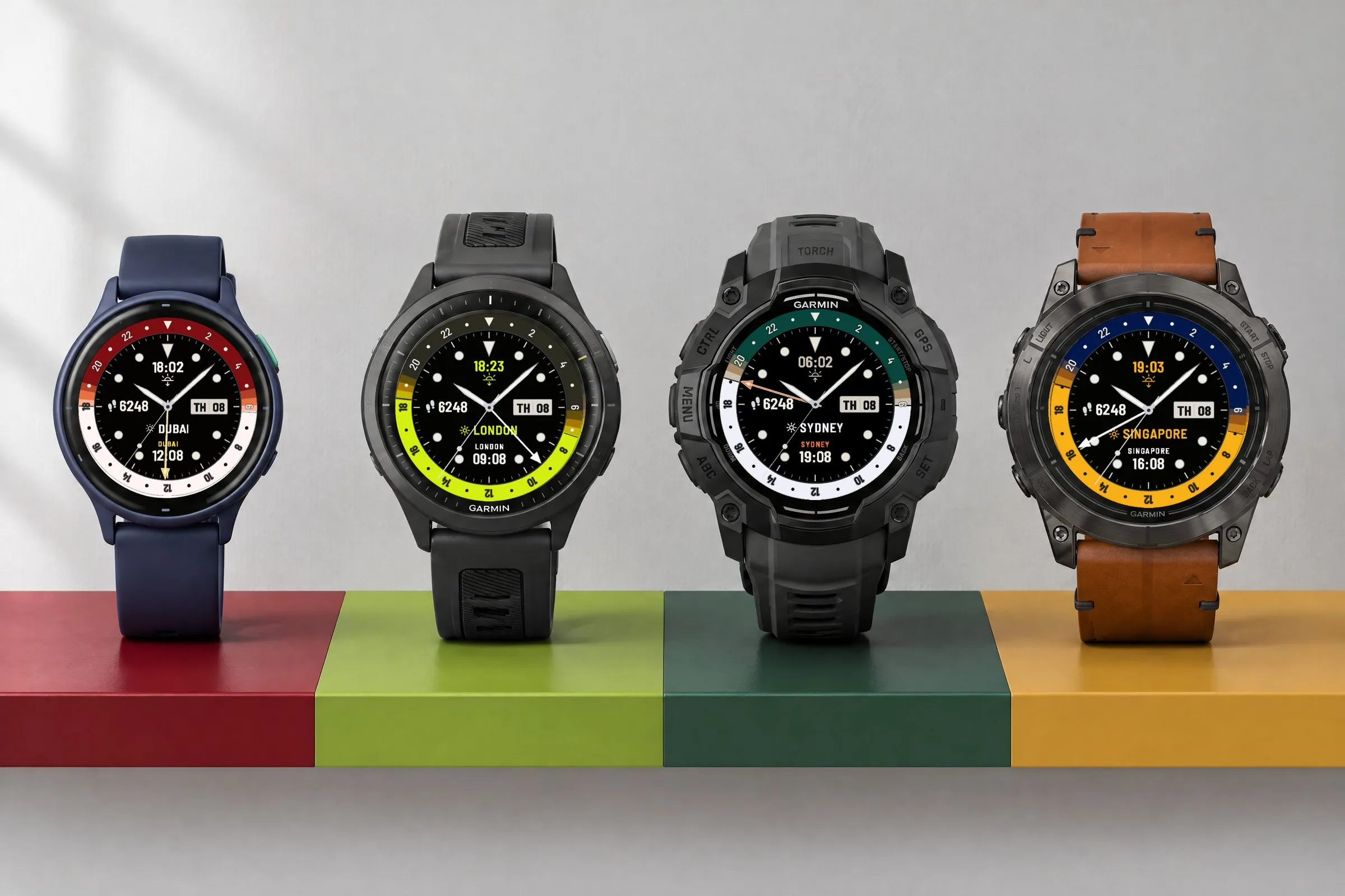 Four Garmin watches with the GMT watch face Horizon GMT in the presets Cherry, Lime, Pine and Mustard