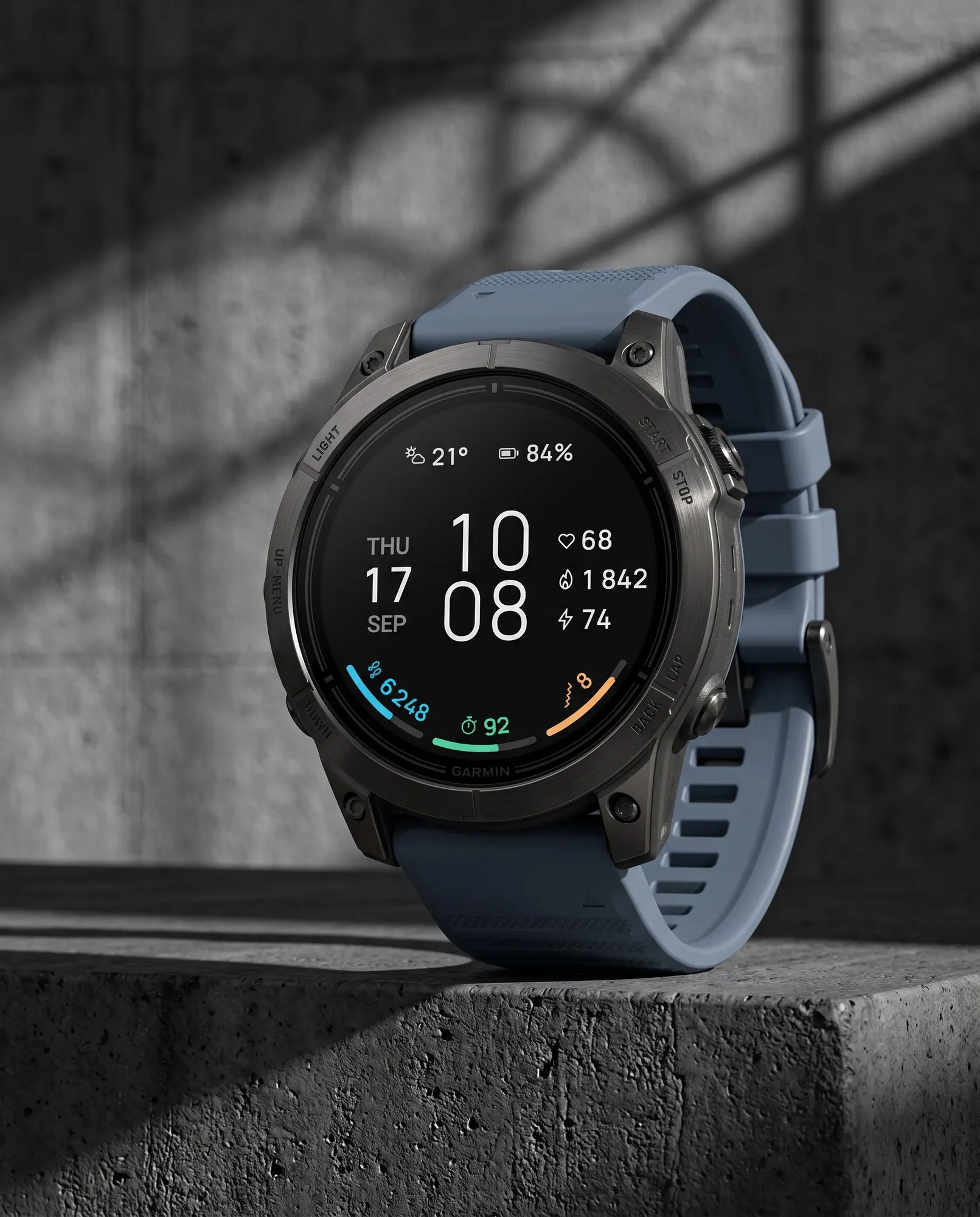 Minimal Garmin watch face ARCLINE in dark mode on an epix Pro on concrete
