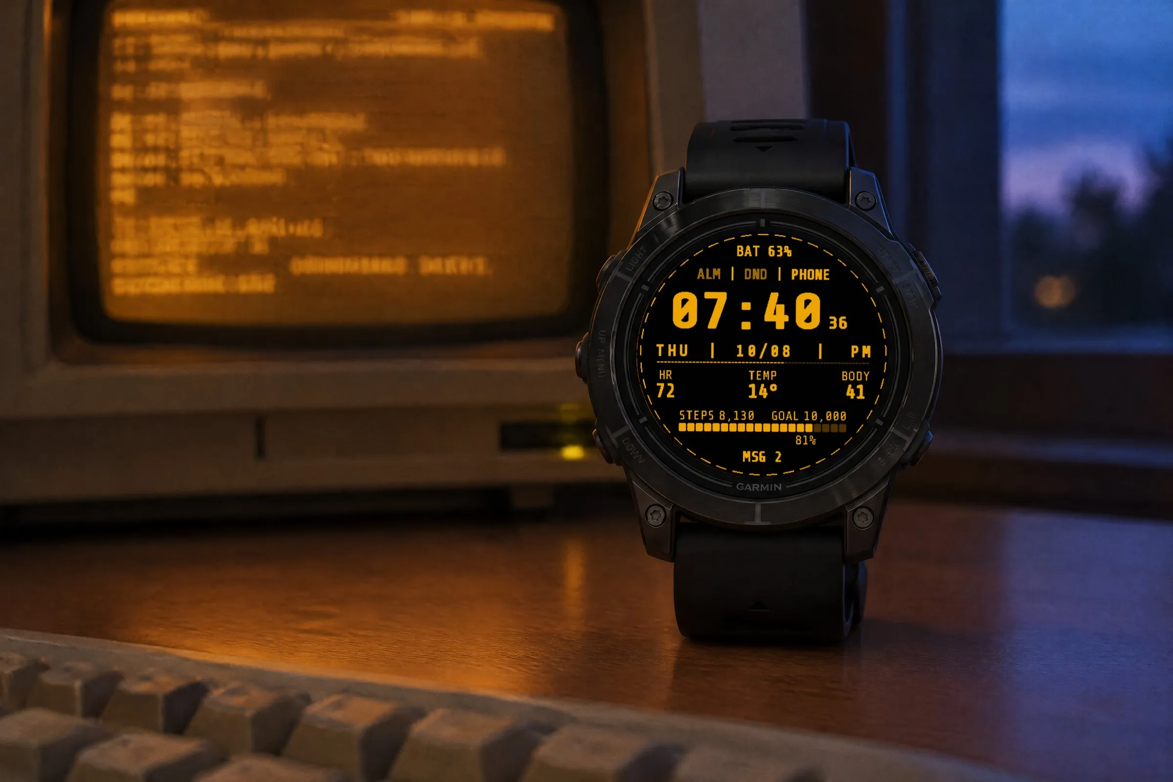 Retro digital Garmin watch face Terminal in amber on an epix Pro in front of an old computer terminal with an amber screen